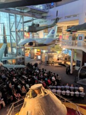 Speaker presenting to an audience in the VASC main gallery