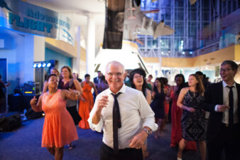 Wedding guests dancing at reception