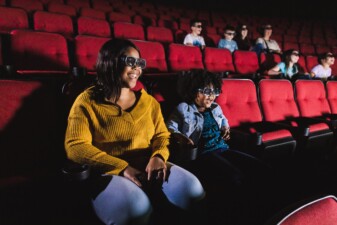 Patrons enjoying IMAX movie.